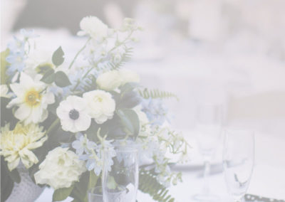 A vase of flowers on a table - Wedding